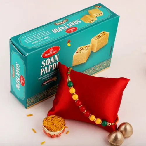 Delightful Combo of Rakhi, Roli Tika N Rakhi Card with Soan Papdi