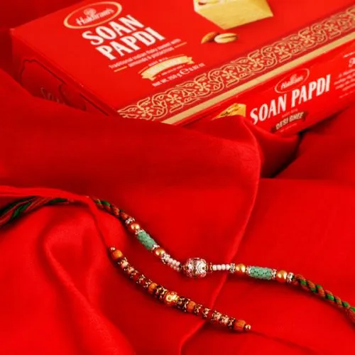 Tasty Soan Papdi with 2 Rakhis, Free Roli Chawal and Wishes Card