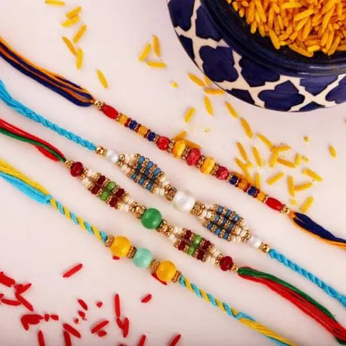 4 Fancy Rakhis, Free Roli Chawal Tika N Message Card Combo