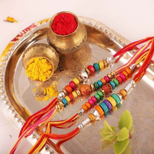 4 Colorful Rakhis with Message Card N Free Roli Chawal