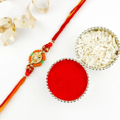 Vibrant Red Mouli Rakhi with glowy Beads