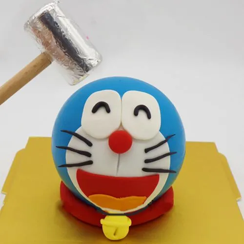 Delivering Doremon Special Pinata Cake with Hammer