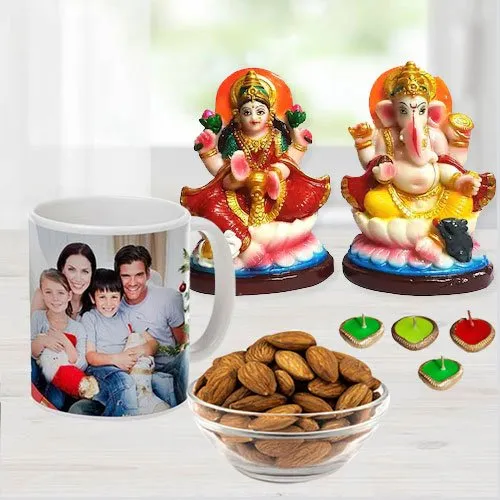 Attractive Ganesh Laxmi Idol with Personalized Coffee Mug Cadbury Chocolates n Almonds Free Wax Diya