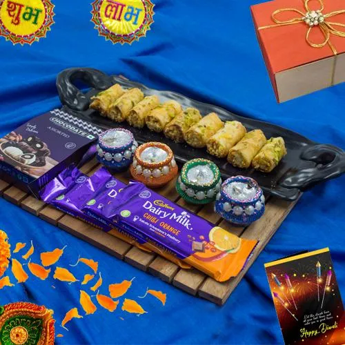 Lovely Gift of Roll Baklava n Cadbury Chocolates with Wax Diya