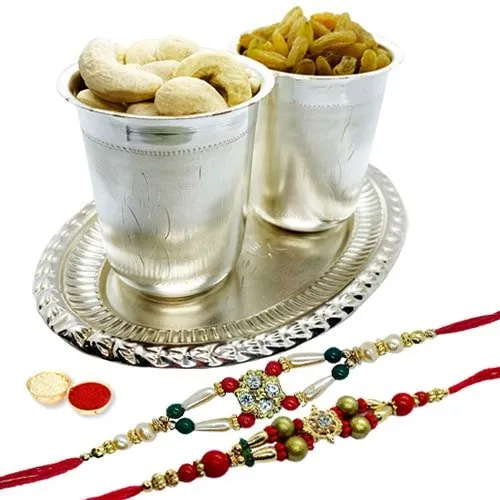 Special dry fruit hamper in Silver plated Glass and tray with 2 free Rakhi, Roli tilak and Chawal