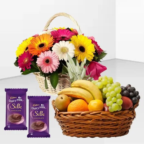 Shop for Mixed Fruits Basket with Gerberas Arrangement and Dairy Milk Silk