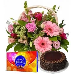 Send Chocolate Cake with Seasonal Flowers Basket and Cadbury Celebrations