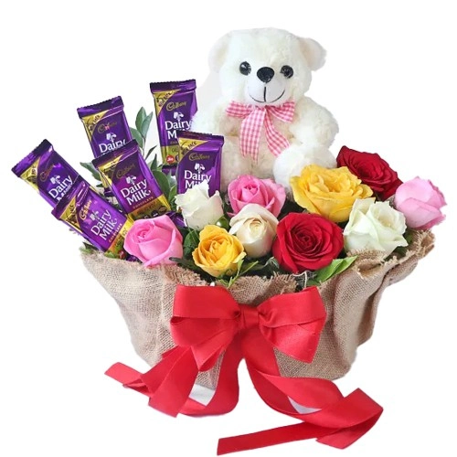 Gorgeous Display of Mixed Roses n Cadbury Dairy Milk with Teddy in Basket