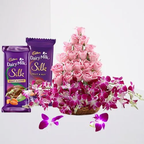 Valentine Pink Roses n Purple Orchids in Basket with Cadbury Silk Pair