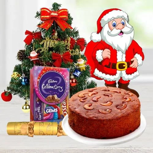 Christmas Fruit Cake 1 Lbs. with Christmas Tree 1 Ft. long artificial, Assorted Cadburyï¿½s Chocolates for hanging ( 130 G.), Star and Bells for decoration, Santa Claus and  Handheld Ribbon Crackers for Christmas