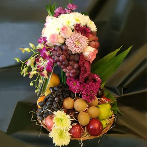 Lovely Tall Arrangement of Flowers n Fruits