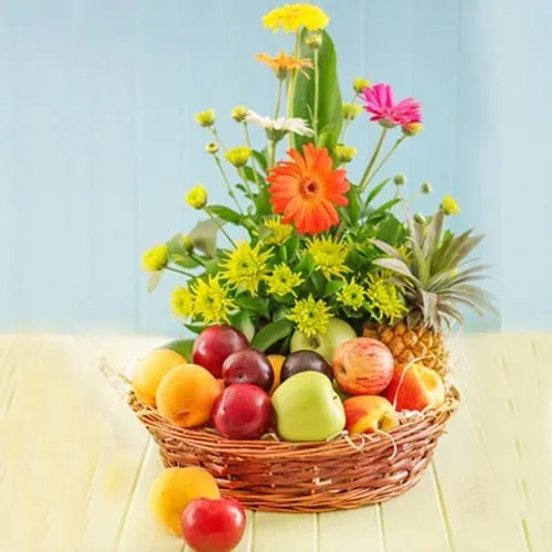 Tantalizing Fresh Fruits with Gerberas Gift Basket