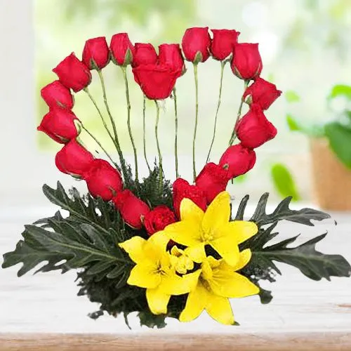 Arresting Red Roses Heart with Lilies Arrangement