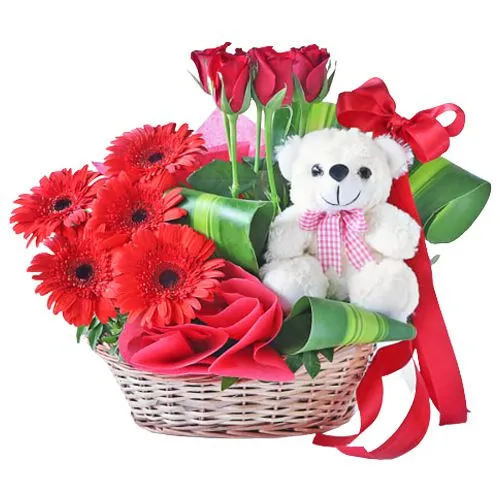 Artistic Red Gerberas N Roses Basket with White Teddy
