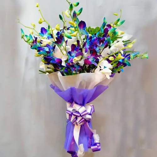 Beautiful Blue n White Orchids Bouquet with Tissue Wrapping	