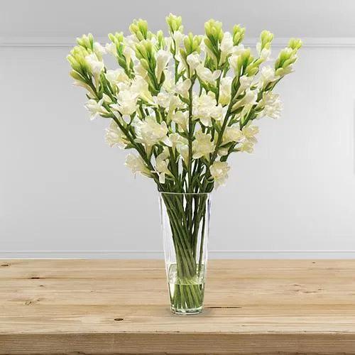 Deliver 15 White Tube Roses Sticks in a Glass Vase
