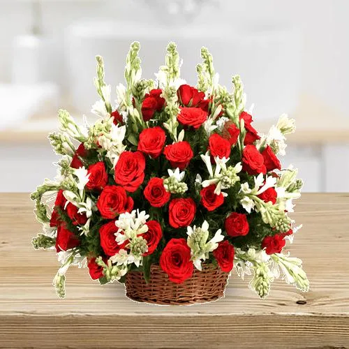 Ornamental Display of Red Roses n Rajnigandha in a Basket