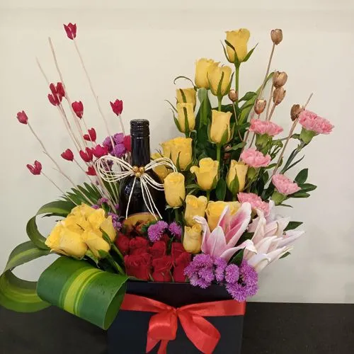 Exquisite Box Arrangement of Mixed Flowers with Sparkling Fruit Juice