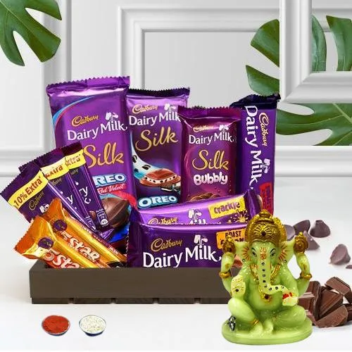 Dreamy Cadbury Delight Gift Basket with Glowing Ganesha N Roil Chawal
