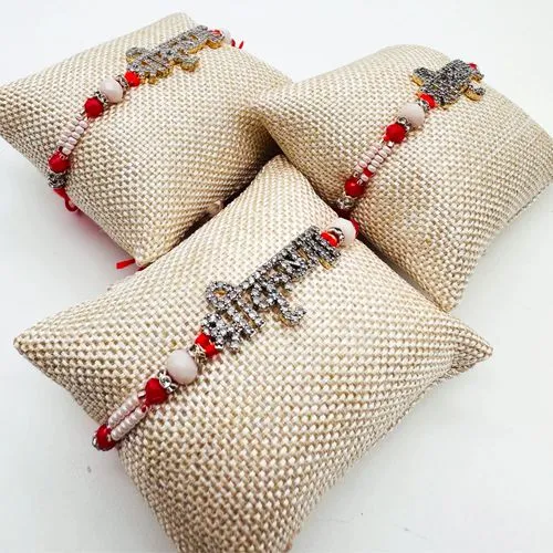 Beautiful Stone Studded Rakhi In a cushion packing