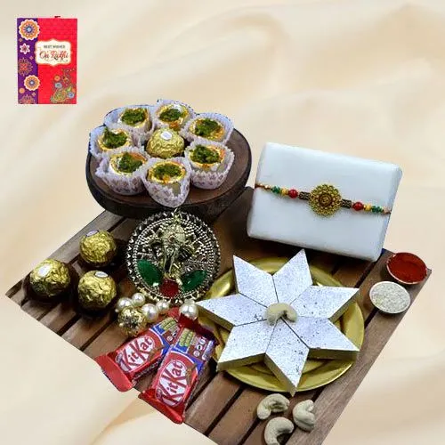 Exquisite Gift of Om Rakhi, Puja Thali, Haldiram Sweets N Chocolates