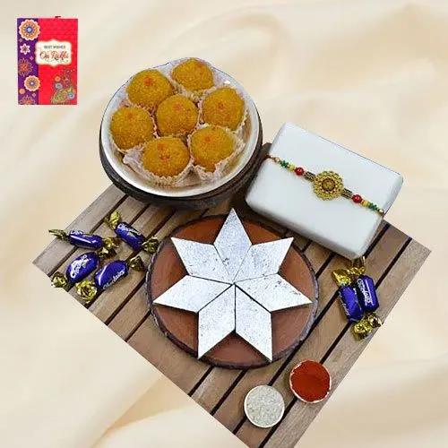 Elegant Om Rakhi with Haldiram Mithai, Chocolate N Puja Thali