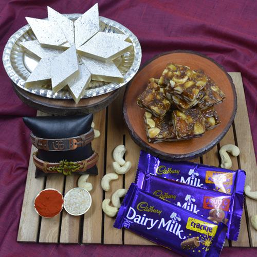 Admirable Om Rakhi with Puja Tray, Haldiram Sweets N Cadbury Chocolates