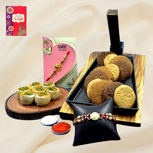 Traditional Haldiram Kaju Pista Basket with Cookie Mans Cookies  N  Twin Rakhi