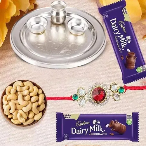 Admirable Rakhi Special Gift of One Silver Puja Thali with One Fancy Rakhi and Spicy Cashew Nuts