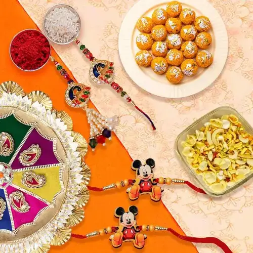 Ecstatic Combo of Boondi Ladoo, Masala Peanuts, Rakhi Thali, 1 Bhaiya Bhabhi Rakhi Set and 2 Kids Rakhi