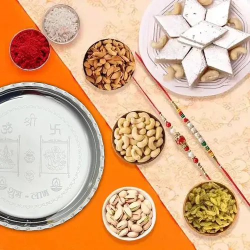 Assorted Dry Fruits , Fantastic Silver plated Thali, Kaju Katli along  with 2 Free Rakhi, Roli Tika and Chawal