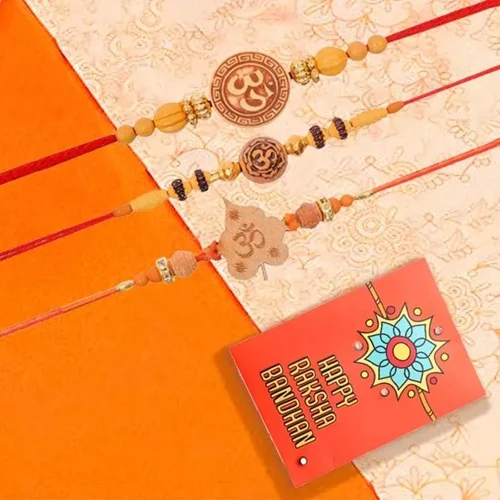 Graceful Three Om Rakhi Set with Roli Chawal Tika n Rakhi Card