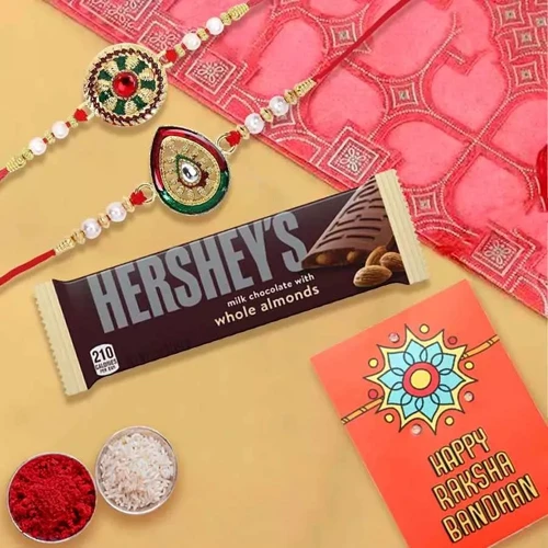Exquisite Rakhi Pair with Hersheys Kisses Chocolates