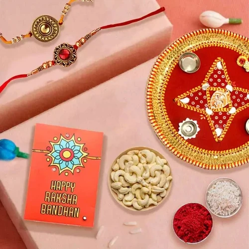 Admirable Gift of Two Rakhis with Cashews n Puja Thali