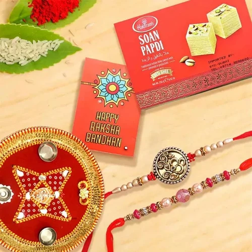 Elegant Pair of Rakhi with Puja Thali N Haldiram Soan Papadi