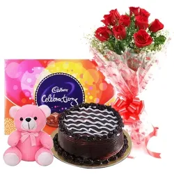 12 Exclusive Dutch Red Roses Bouquet with Cake , Cadburys Assorted Chocolates and a Cute Teddy Bear